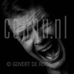 24-08-1999 Peter Jan Rens at studio in Amsterdam on behalf of Schreeuwen project.

[keywords]Black and White Image, Headshot[/keywords]